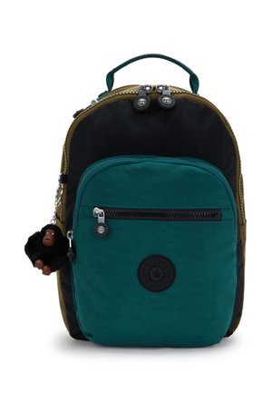 Small two-tone backpack in black and green with front zip pocket, top handle, double zipper, and a black plush monkey keychain attached.