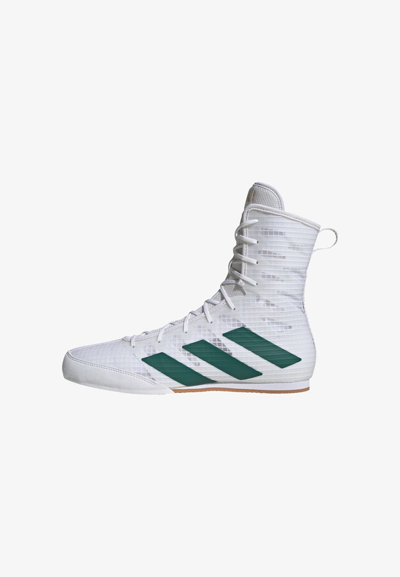 White athletic shoe with a high ankle design, textured upper, and three green diagonal stripes. Features laces and a rubber sole.