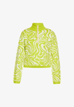 Rövidített, hosszúujjú pulóver élénk lime zöld színben, fehér hullámos mintával, magas nyakkal és elülső cipzárral. Puha kötött textúra.