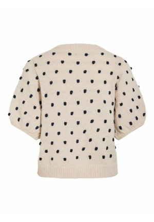 Pull en maille beige avec manches courtes bouffantes, orné de pois noirs duveteux uniformément espacés sur toute la surface.
