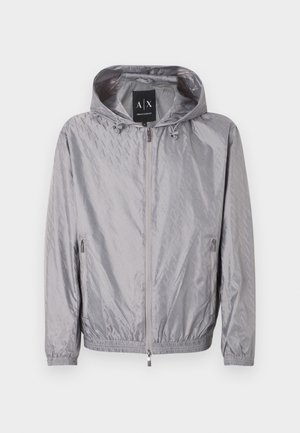 Light gray zip-up hooded jacket with subtle embossed pattern and two zippered side pockets, elastic cuffs, and Armani Exchange label inside collar.