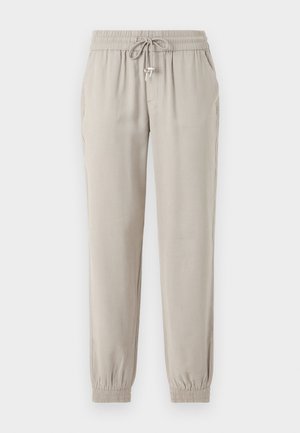 Šviesiai smėliniai džinsiniai kelnės, pagamintos iš minkštos medžiagos, su elastinga juosta ir raišteliu, šoniniais kišenėmis ir elastinėmis rankovėmis.