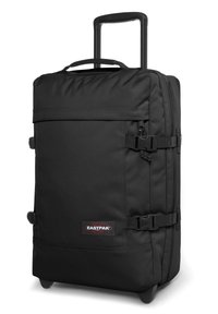 Valigia nera con ruote realizzata in tessuto resistente. Presenta un manico estraibile, cinghie di compressione e un logo Eastpak ben visibile.