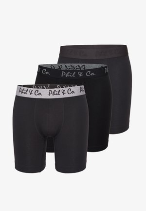 Trzy pary czarnych bokserów wykonanych z miękkiego materiału. Posiadają elastyczne paski w talii z logo "Phil & Co.". Wyraźne odcienie czerni i szarości.
