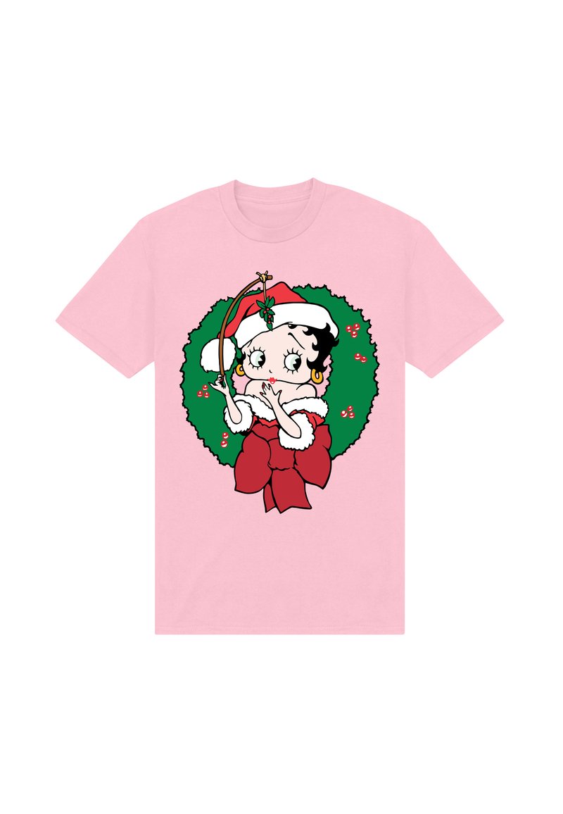 T-shirt rosa con un personaggio dei cartoni animati dai capelli neri e ricci, un cappello di Babbo Natale rosso, circondato da una ghirlanda verde con accenti rossi.