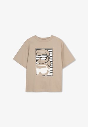 Beež lühikeste varrukatega t-särk, millel on multifilmikujutis prillidega ja sabaga inimesest ning kujunduse all tekst "KARL LAGERFELD".