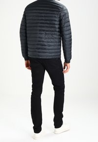 Tommy Hilfiger Dunjakker - black