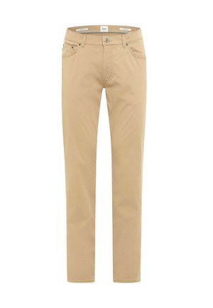 Beige, schmal geschnittene Chinos aus Baumwolle. Verfügen über einen Reißverschluss, Vordertaschen und eine einzelne Gesäßtasche. Glatte Textur, klare Linien.