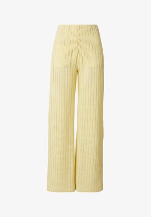 Yellow wide-leg crochet knit pants with high waist and open weave pattern.