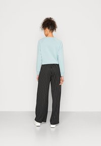 JDY JDYLOUISVILLE CATIA WIDE PANT - Calças - black