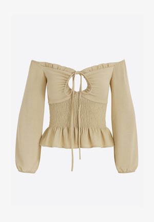 Beżowa bluzka z odkrytymi ramionami, z marszczonym gorsetem, falbaną u dołu, długimi rękawami i wiązaniem z tyłu. Miękki materiał o fakturowanym wykończeniu.