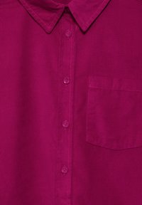 Fuchsia button-up shirt with a collar, featuring a chest pocket and tonal stitching on a slightly textured fabric. Six matching buttons.