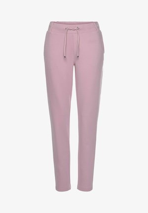 Light pink jogger pants made of soft fabric, featuring an elastic waistband with a drawstring and tapered legs. No visible patterns.