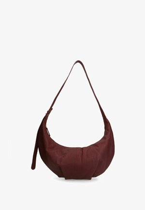 Burgundy leather shoulder bag with a rounded shape, seam details, and a single long strap. Features a zip closure. Smooth texture.