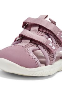 Purple toddler sandals with elastic straps, mesh panels, and a white rubber sole. Features a rounded toe and sturdy design for comfort.