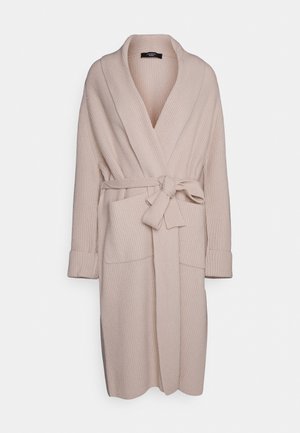 Beige ribbed bathrobe with a shawl collar, long sleeves, a belt at the waist, and two front pockets. Soft texture and relaxed fit.