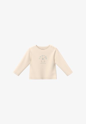 Crèmekleurig shirt met lange mouwen van zachte stof met drukknopen op de schouder. Voorzien van een bedrukking met een schattig figuur en tekst aan de voorkant.