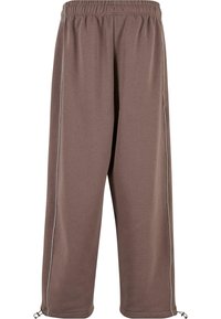 Brown sweatpants with an elastic waistband, side piping, and adjustable cuffs. Made from soft fabric for comfort and mobility.