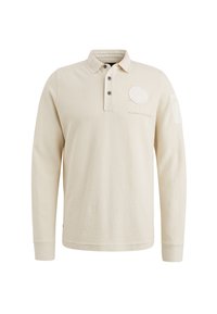 Polo à manches longues beige avec un col boutonné, deux boutons noirs, en tissu de coton texturé et un écusson logo circulaire sur la poitrine.