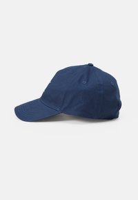 Navy blue baseball cap with a curved brim, cotton fabric, six panels, and a top button. Features ventilation eyelets on the sides.