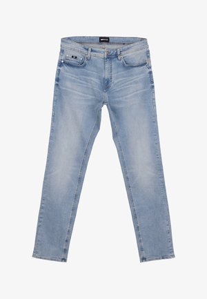 Jeans slim fit azzurro chiaro con tasche frontali, chiusura con bottoni e dettagli sbiaditi lungo cosce e ginocchia.