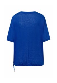 Haut ample bleu roi uni à manches courtes avec encolure ronde et ourlet à cordon réglable, vu de dos.