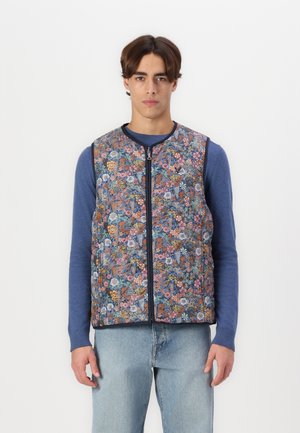 Floral-patterned vest with a zip front, featuring various shades of blue, pink, and orange flowers on a dark background. Textured fabric.