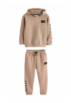 Beige hoodie and matching sweatpants set, featuring a textured design, slanted panel, black logo accents, and adjustable drawstring waistband.