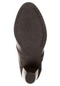 Semelle de chaussure noire avec surface en caoutchouc texturé, dotée d'un petit talon et d'une étiquette de taille 37. La semelle présente un bout rond et des détails sur les côtés.