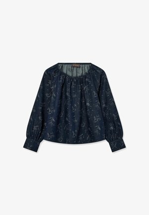 Blouse bleu marine à manches longues avec un motif floral clair subtil, col froncé et poignets boutonnés, posée à plat sur un fond blanc.