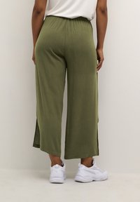 Cream Tygbyxor - dark green