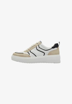 White sneaker with beige suede and black accents, featuring a chunky white sole, rounded toe, and textured detailing. Six lace eyelets.