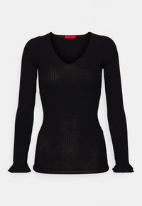 Svart ribbad långärmad V-ringad figurnära tröja med lätt utsvängda ärmar, uppvisad på vit bakgrund.