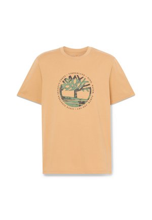 Beige lyhythihainen T-paita, jossa vihreä puukuvio ympyrän sisällä ja teksti "Timberland" sekä "Since Nineteen Seventy-Three".