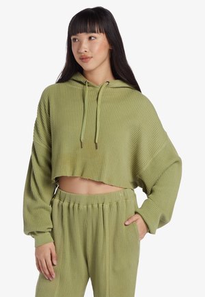 Light green cropped hoodie with ribbed texture, drawstring hood, and wide sleeves, paired with matching ribbed pants featuring an elastic waistband.