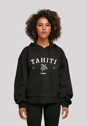 Black hoodie made of soft fabric, featuring a large front print with "TAHITI 2023" and a spiral design. Oversized fit with a drawstring hood.