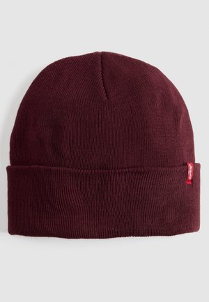 Maroon beanie made of knitted fabric, featuring a ribbed texture and a folded cuff. A small red Levi's tag is visible on the side.