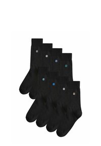 Mustat puuvillasukat, joissa on ribbiresori, sileä rakenne ja pieniä värikkäitä logokoristeita nilkassa. Kuuden parin pakkaus.