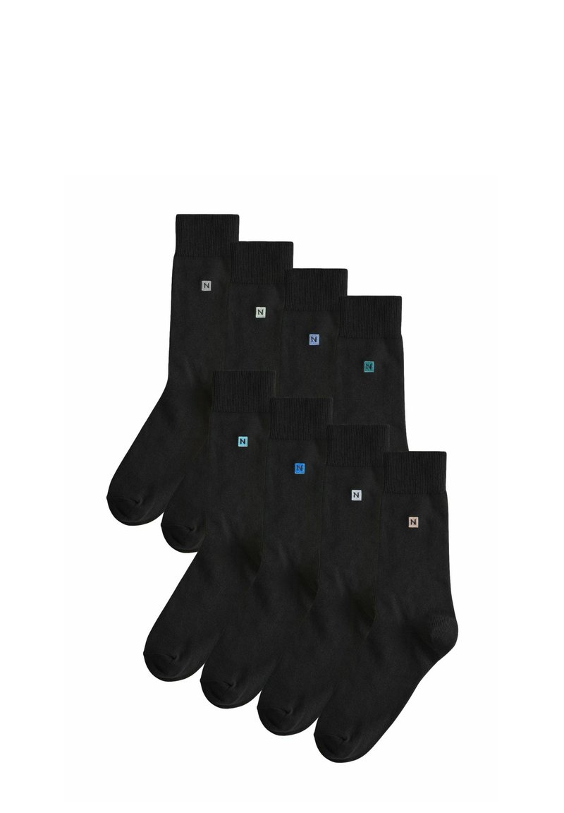 Mustat puuvillasukat, joissa on ribbiresori, sileä rakenne ja pieniä värikkäitä logokoristeita nilkassa. Kuuden parin pakkaus.