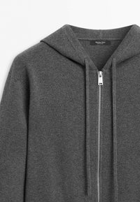Dark gray zip-up hoodie with drawstrings and a visible zipper, showing the upper section including the hood and collar area.