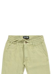 Lichtgroene broek gemaakt van zachte stof, met een elastische tailleband, koordsluiting en twee zakken aan de voorkant. Merklabel zichtbaar.