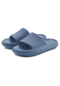 Blue plastic slide sandals with a textured strap and open toe design. The outsole features a textured grip pattern for stability.
