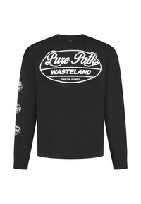 Zwart shirt met lange mouwen en witte grafische prints op de achterkant en mouwen, met de tekst "Pure Path WASTELAND" en "Own the Journey".