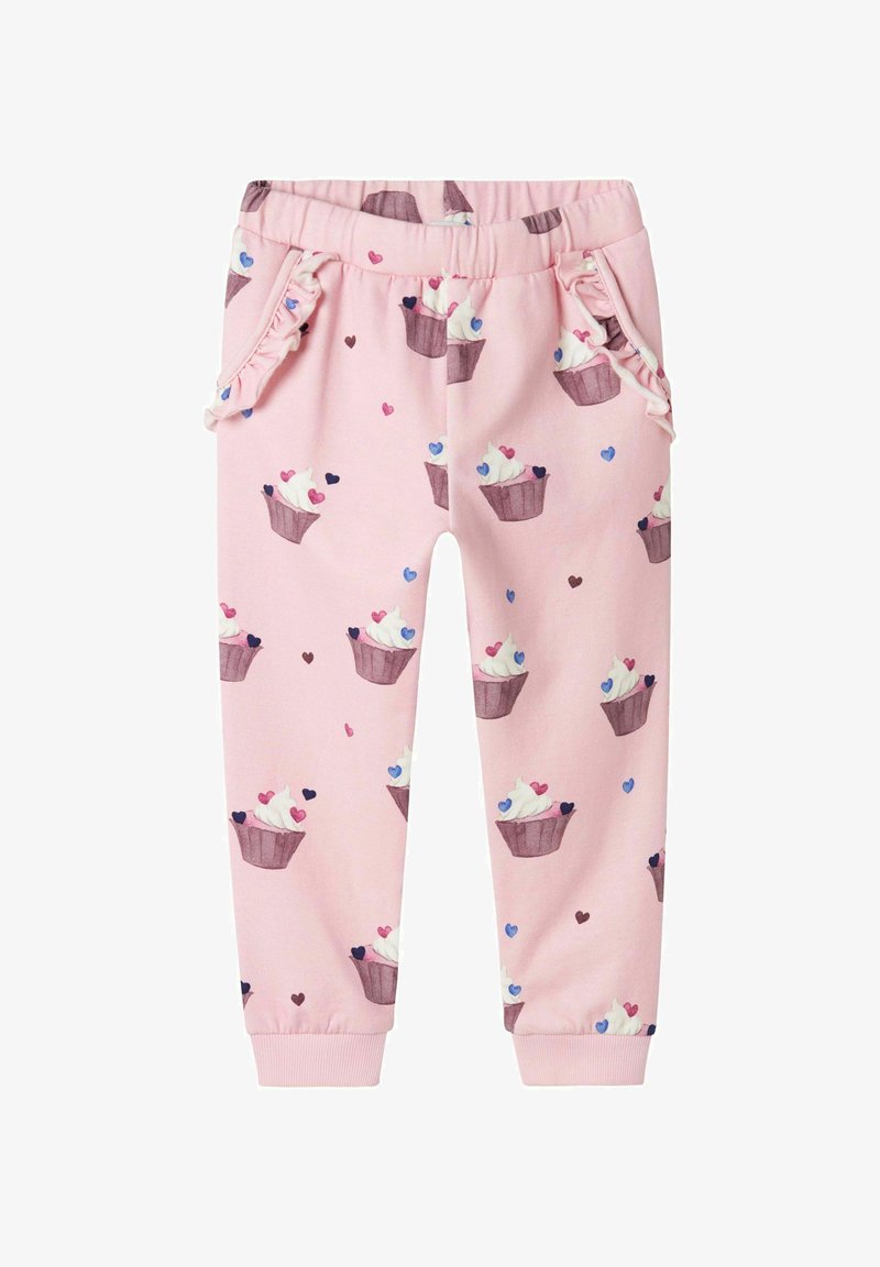 Roza bombažna trenirka s potiski tortic in srčkov, z naborki na robovih žepov in elastičnimi manšetami pri gležnjih.