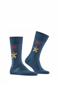 Ciemnoniebieskie skarpetki bawełniane z wzorem pierniczkowego ludka w okularach przeciwsłonecznych i czerwoną napisem "MOCNY CIASTEK". Gładka tekstura, długość do kostki.