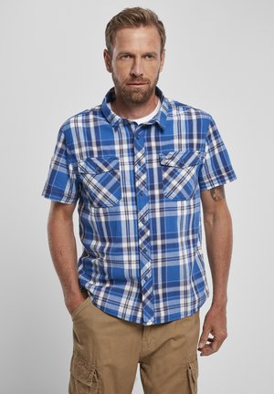 Chemise à manches courtes en carreaux bleu et blanc, dotée d'un col boutonné, de deux poches sur la poitrine et d'un ourlet arrondi.