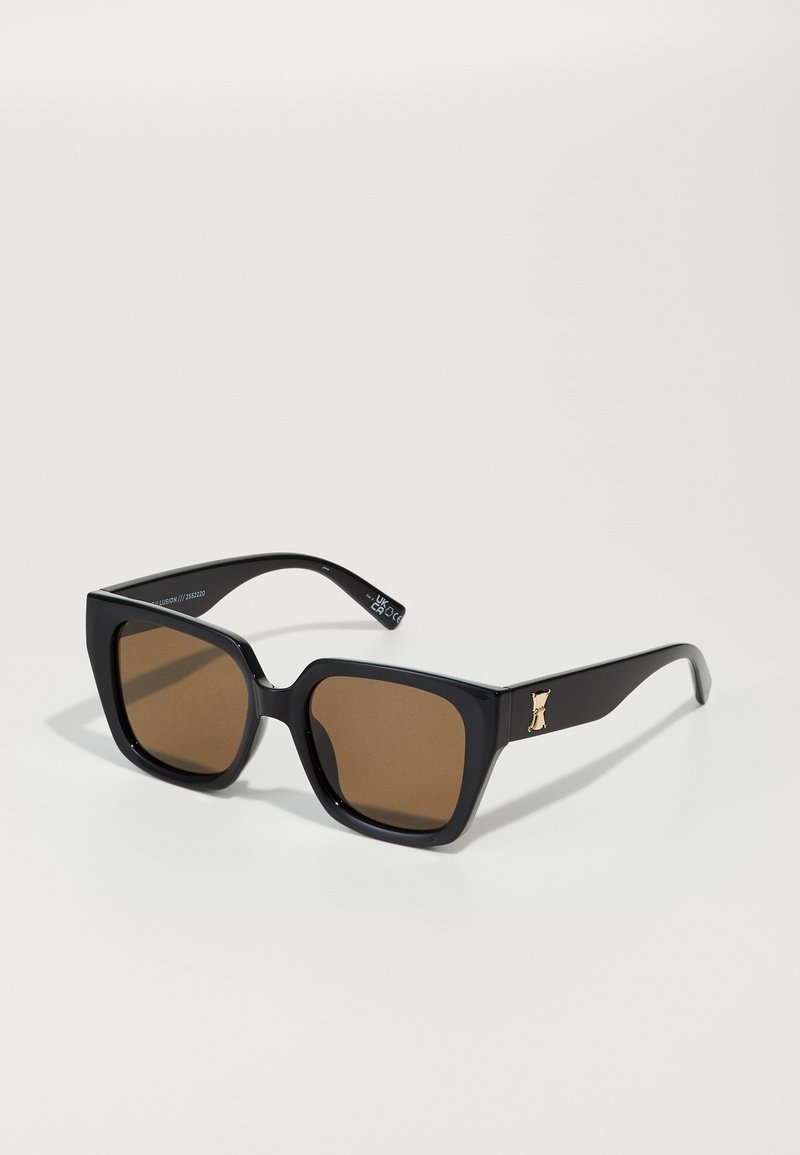 Black rectangular sunglasses with brown lenses, featuring a gold accent on the arm. Smooth plastic material and wide frame design.