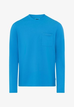 T-shirt bleu à manches longues en coton doux, avec un col rond et une petite poche sur le devant, côté gauche.