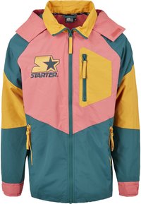 Veste Starter pour hommes à blocs de couleurs avec des panneaux roses, jaunes et bleu sarcelle, poches zippées et fermeture éclair à l'avant.