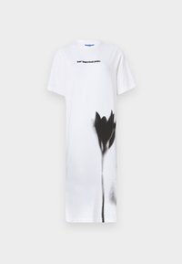 Balta t-shirt suknelė, pasižyminti juodu purkštuvu nupieštu gėlės dizainu. Išryškintas užrašas "karl lagerfeld jeans" juoda spalva, suapvalintas kaklas, trumpomis rankovėmis.